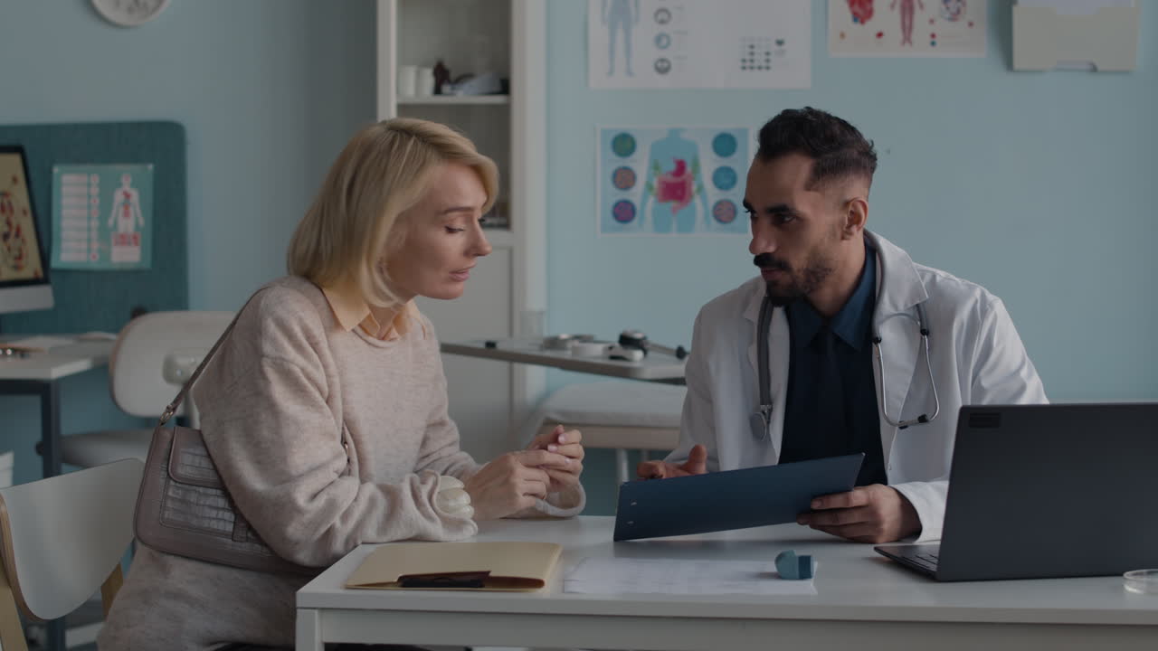 Doctor consulting with patient in clinic