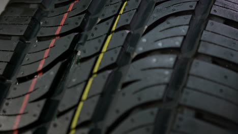 macro motion along modern finished tyre with marks