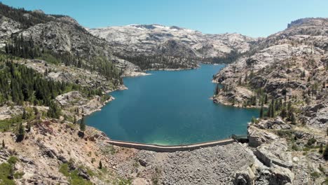 aerial shot of a large dam in california's relief reservoir near kennedy meadows