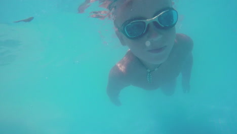 child diving in the swimming pool