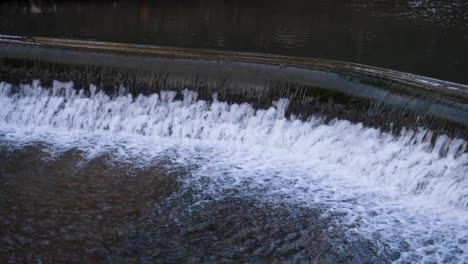 Close-up-of-beautiful-Yeo-River-weir-in-village-of-Cheddar-on-the-Mendip-Hills-in-Somerset,-England