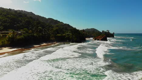 Aerial-fooatge-of-a-surfer-crashing-while-riding-a-wave