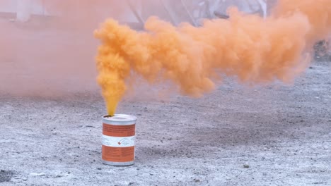 Vibrant-orange-smoke-grenade-going-up-into-the-sky