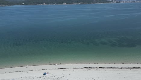 scenic view of a sandy yellow beach and blue sea in the arrabida area, overlooking the ocean