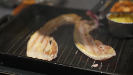 samgyeopsal grill korean bbq, close up slow motion shot