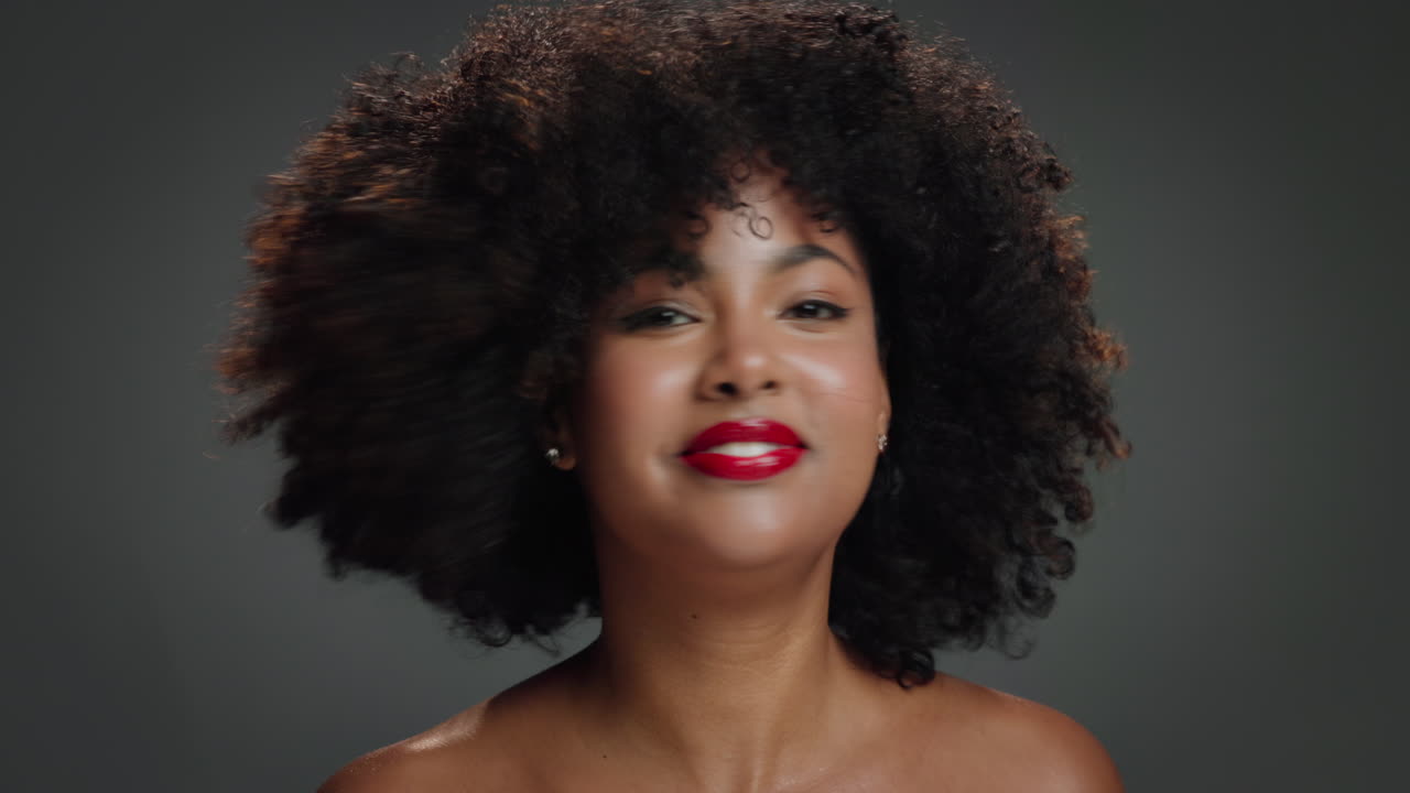 Portrait of a Beautiful Woman with Afro Hair and Red Lipstick