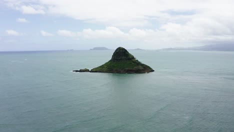 drone shot approaching china man hat island off hawaii's coast