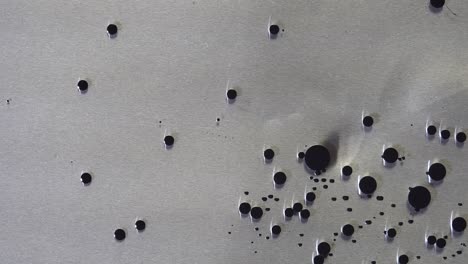 metal surface with dark spots