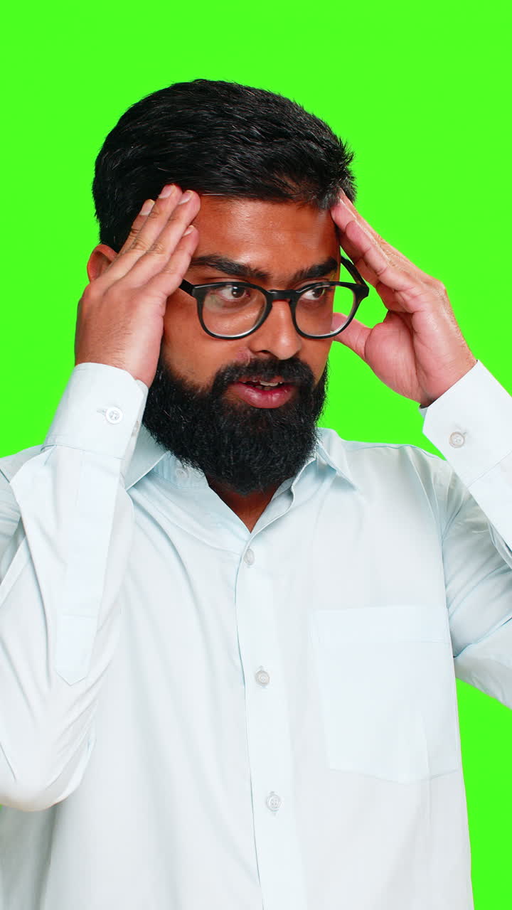 Indian man touching head with hand showing stress pain or emotional suffering moment of worry