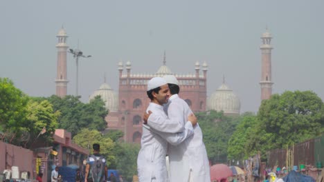 indian muslim men celebrating eid festival in front of jama masjid delhi