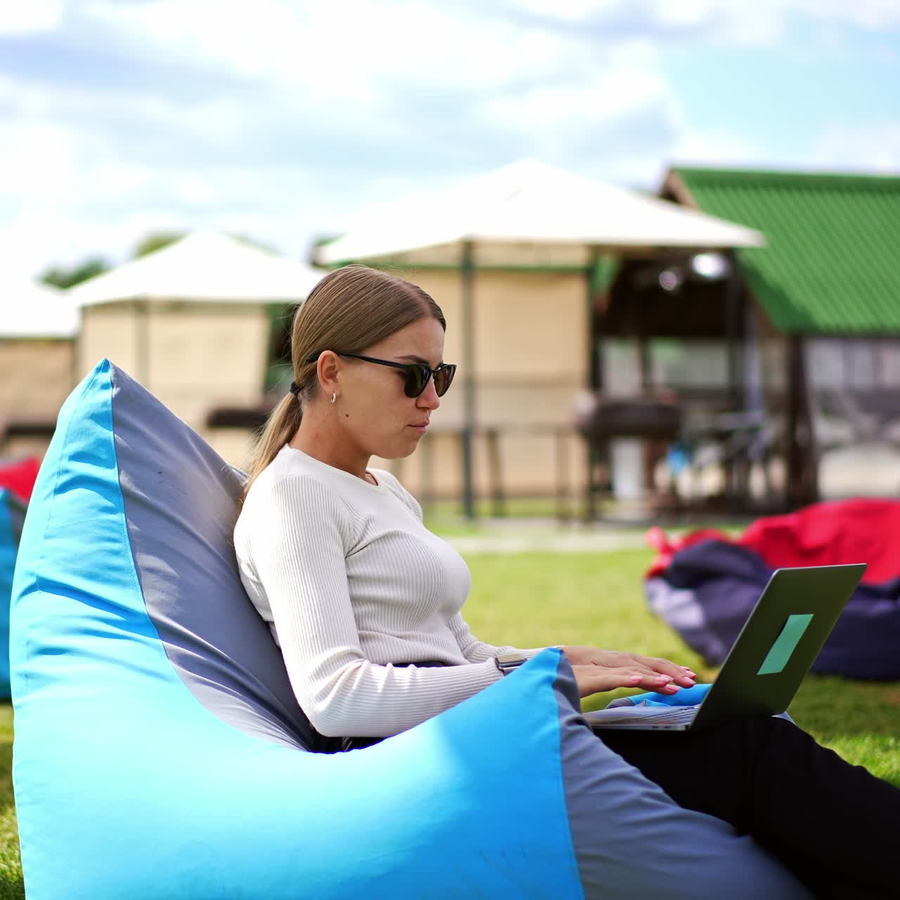 Young mother playing with son outdoor. Cheerful family having fun