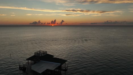 aerial pan view of sunset over mobile bay