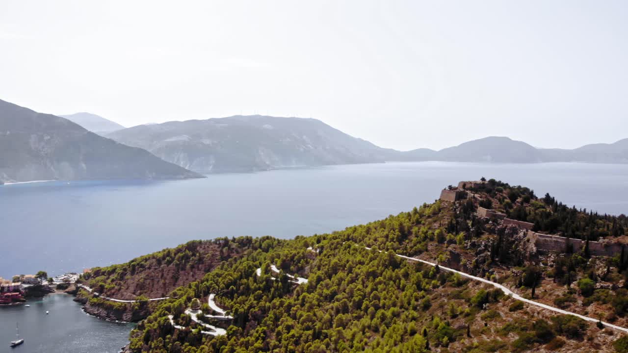 Winding Road Towards The Assos Castle In Cephalonia Island In Western Greece