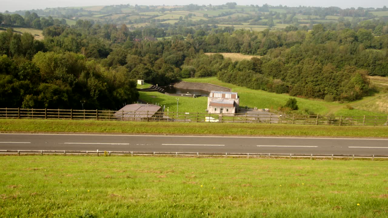 shot of Carsington Water treatment works with the dam road foreground