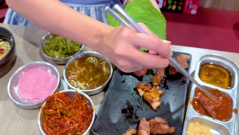 woman enjoying a korean bbq meal