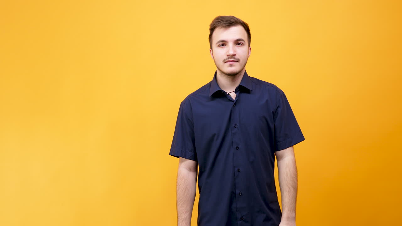 Confused Man in Blue Shirt