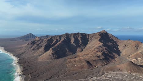 Aerial-View-of-Volcanic-Hills-of-Santa-Luzia-Island,-Cape-Verde