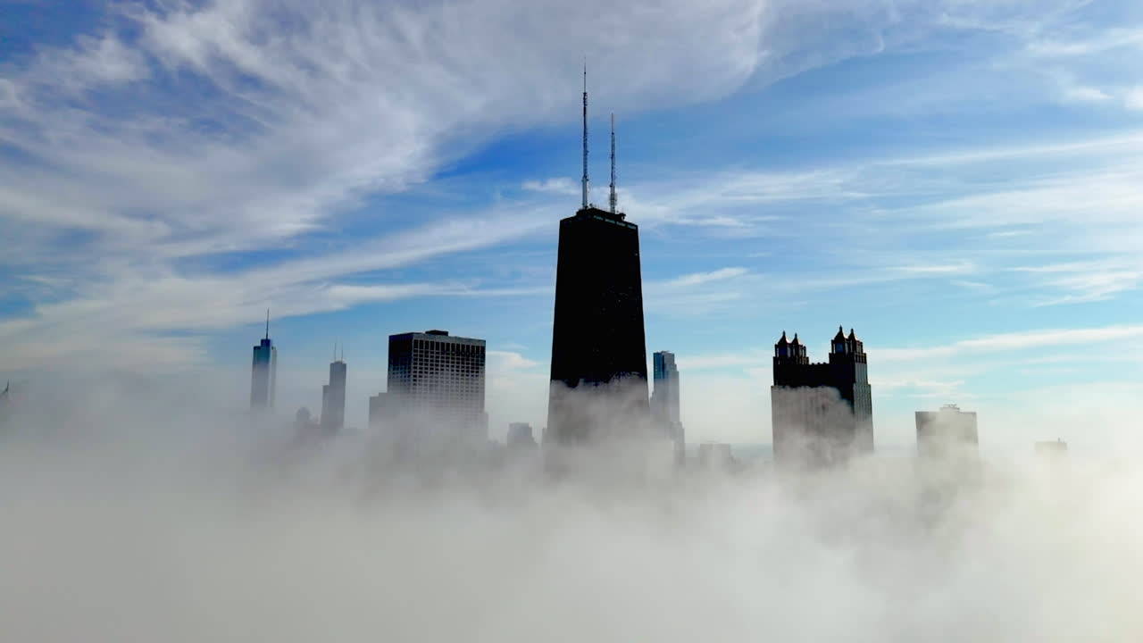 Aerial view over mist, circling famous high-rise of Chicago, morning in USA