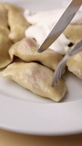 pierogi with sour cream