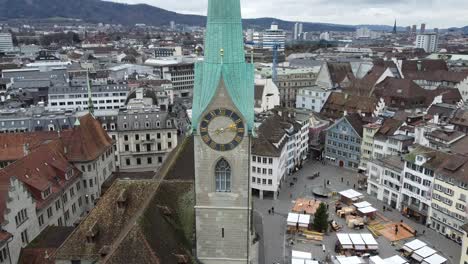 zurich clock tower and city view with limmat river