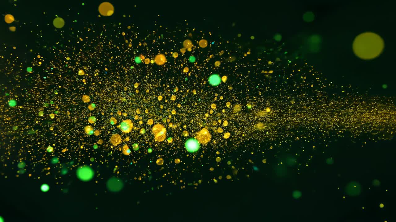 Emitting gold core, sparks moving from left forming center burst on green, green,yellow orbs