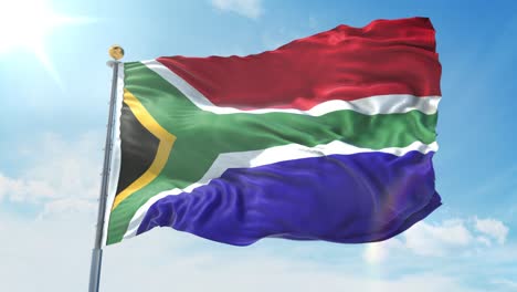 la bandera de sudáfrica ondeando en el viento contra el cielo azul profundo. tema nacional, concepto internacional. renderizado en 3d 4k