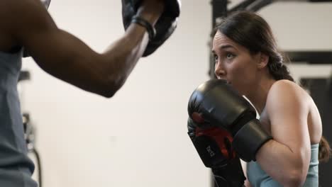woman and man boxing training session