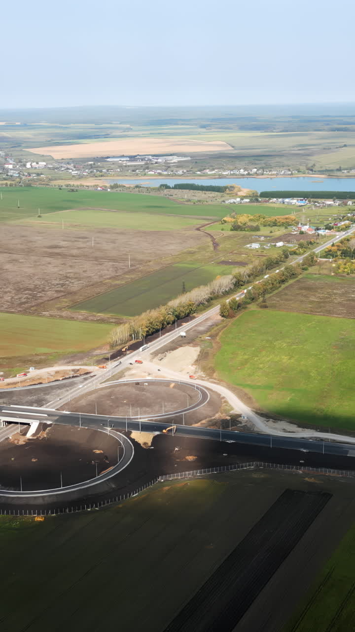 Aerial View of a New Road Interchange and Rural Landscape