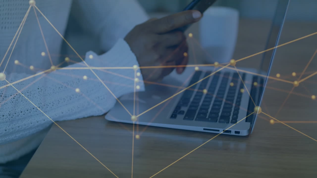 Animation of financial data processing over african american businessman using smartphone