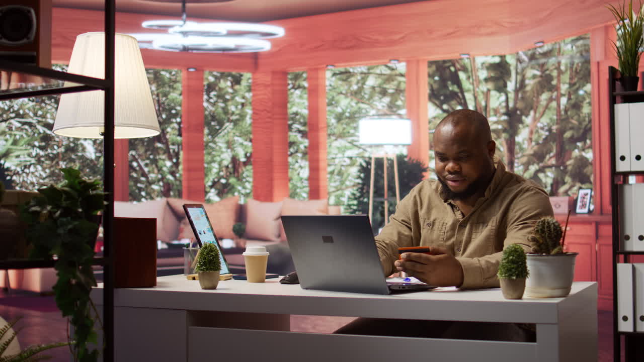 Business owner makes online banking payments with credit card