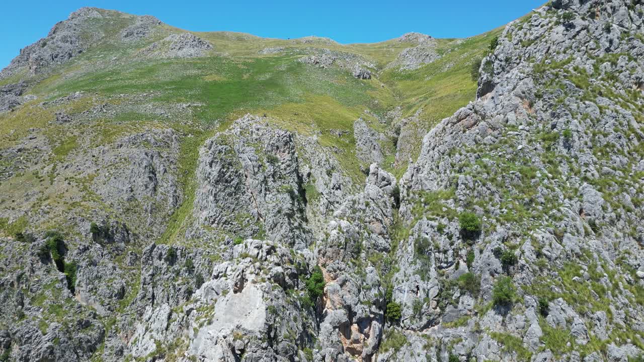 Aerial drone footage of Alcara Li Fusi, Sicily: mountain village, rocky peaks, lush valleys and wild Nebrodi landscapes. Ideal for travel, nature and scenic stock footage