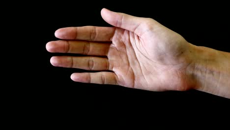 male hand gesture on black background.