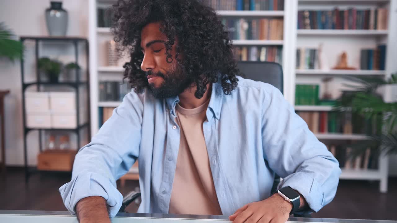 Puzzled young arabian man entrepreneur examines paper financial audit