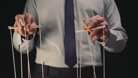 Businessman Pulling Strings