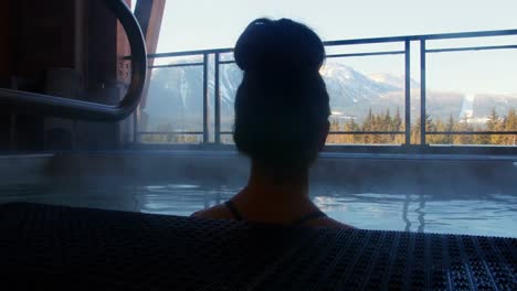 woman relaxing in swimming pool