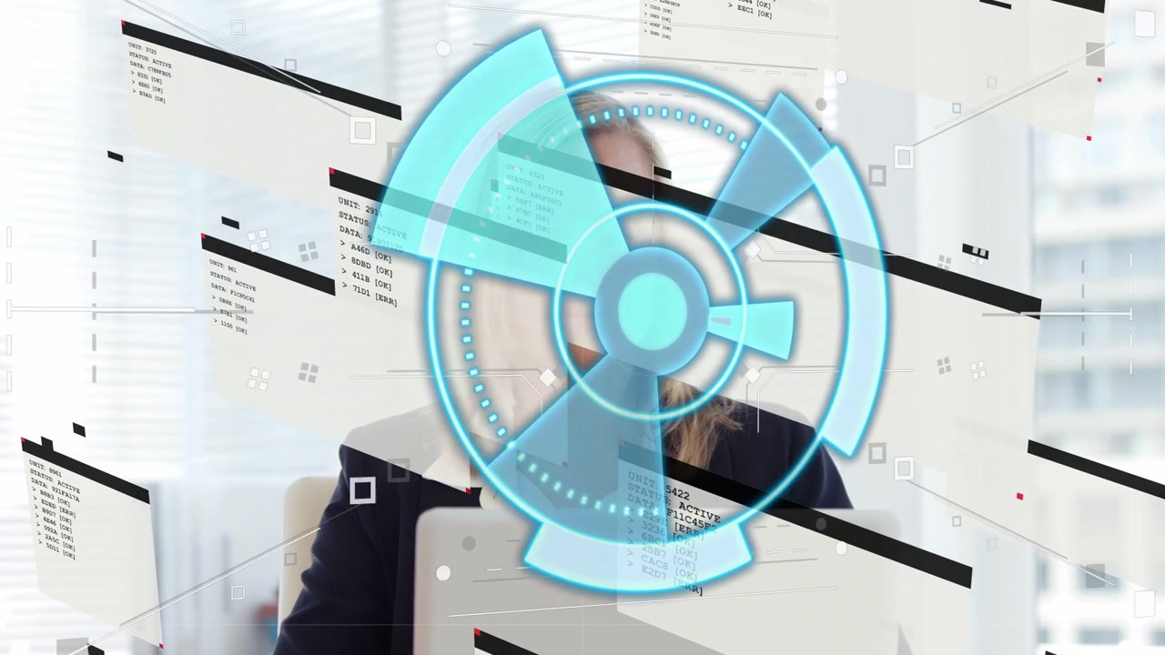 Executive using laptop reviewing data while HUD appearing, obscuring face then revealing panels