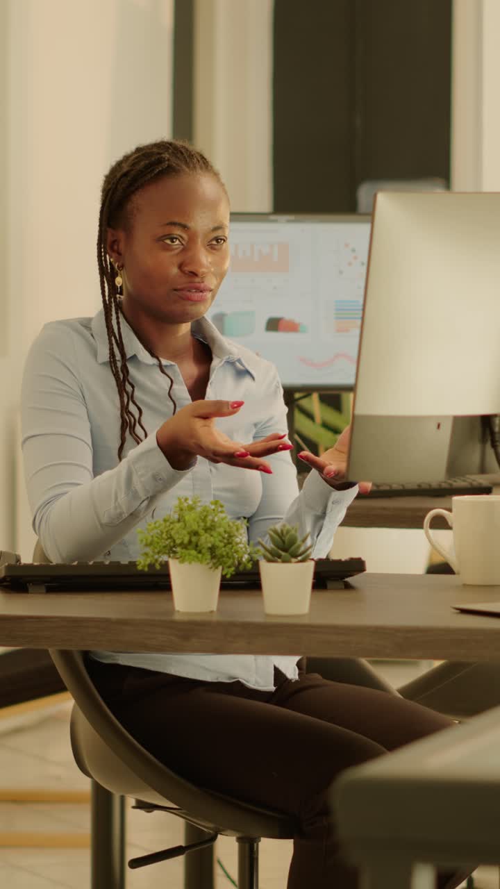 Professional woman working at desk in office