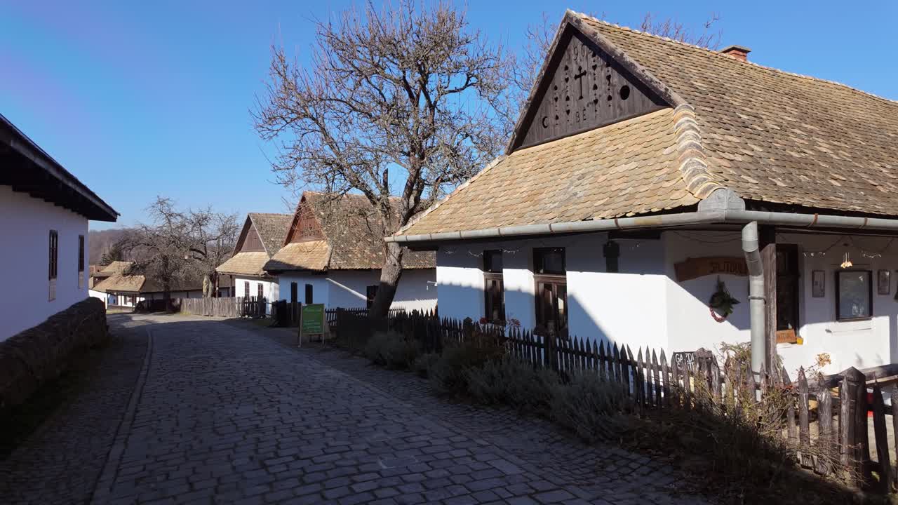 Still life on the street of the old town of Holloko with paloc type houses in on a sunny day in Hungary.