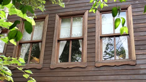 old wooden house facade with traditional windows