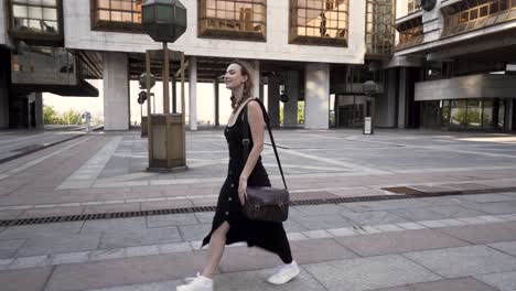 woman walking in a city