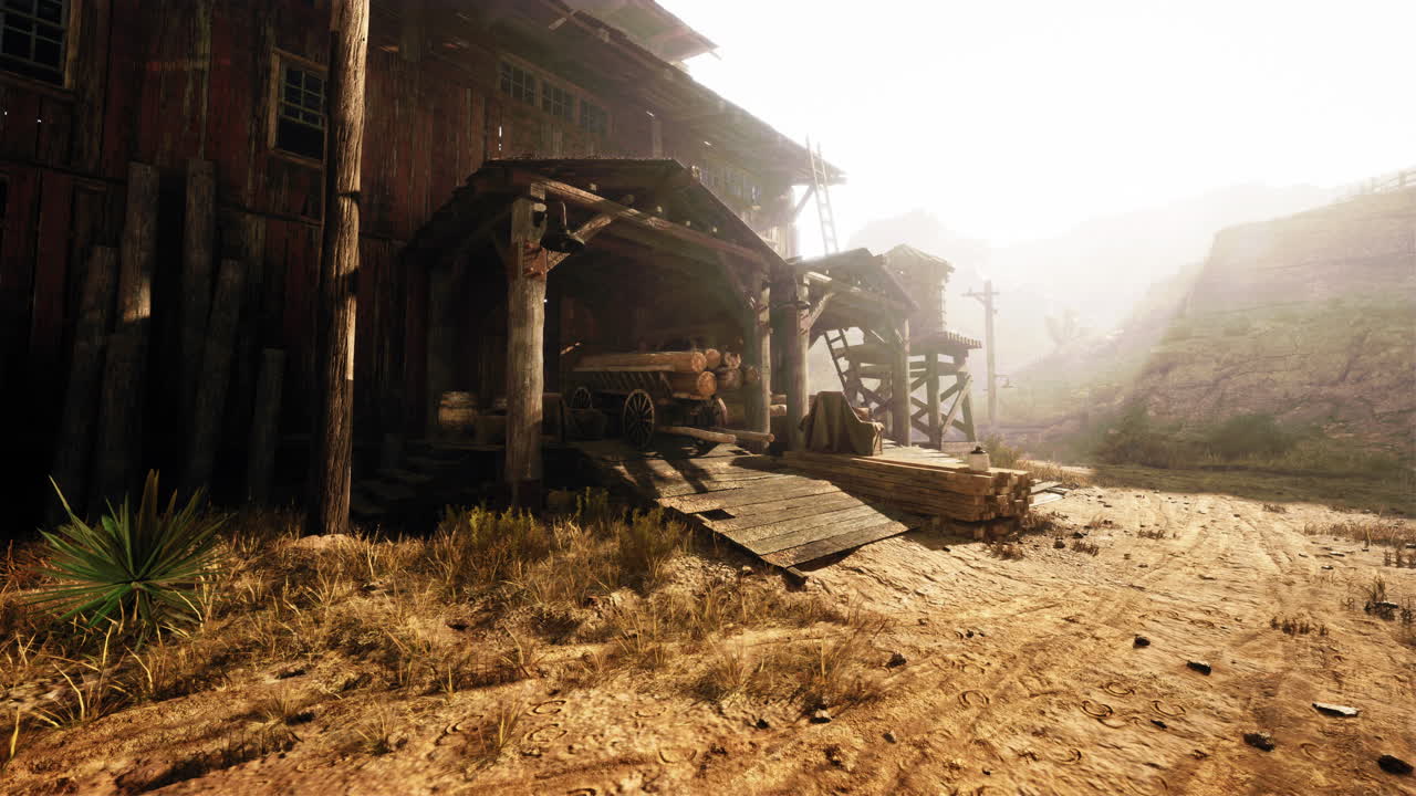 viejo granero occidental y leñador en un paisaje árido