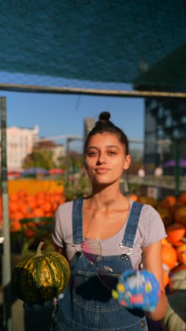 woman at a pumpkin market