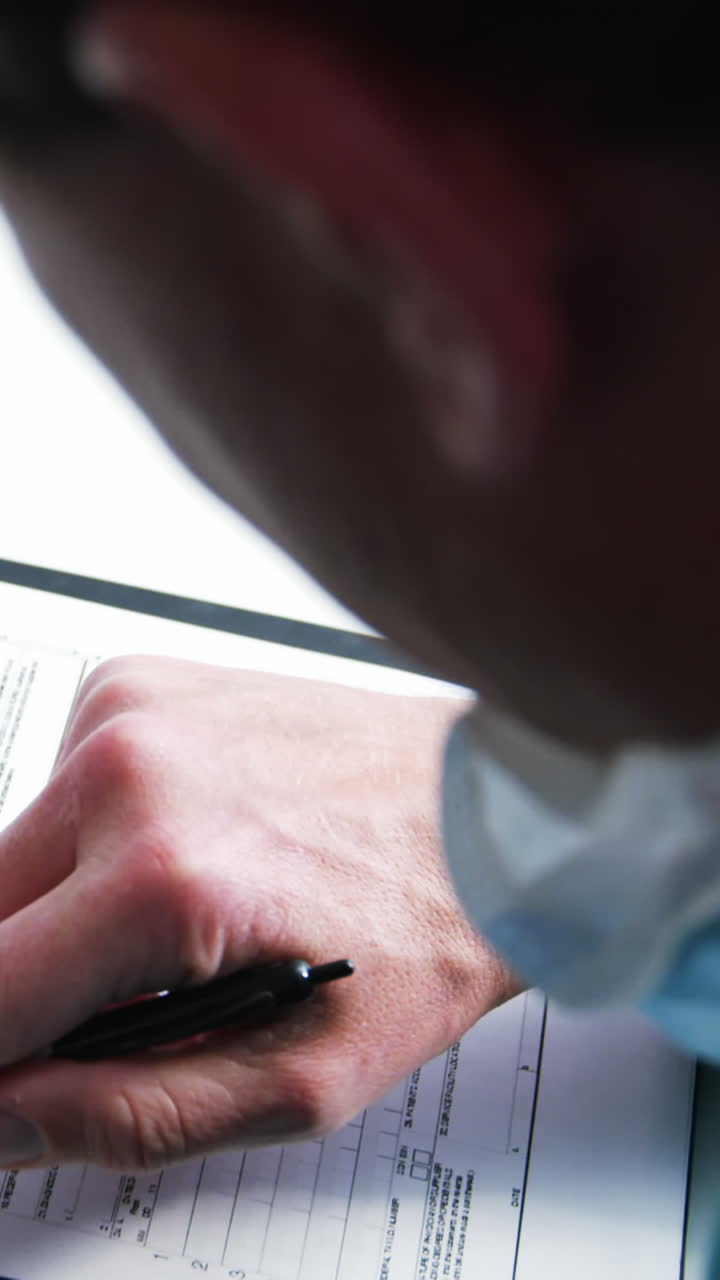 Doctor filling medical insurance form