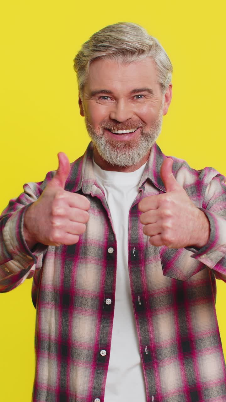 Caucasian man raises thumbs up agrees give positive reply recommends advertisement likes good idea