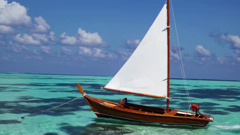 wooden sailboat in turquoise water