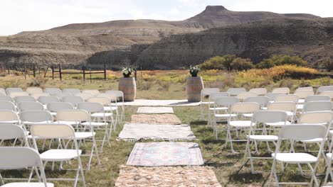 small wedding ceremony set-up in rural wyoming with hills in the background 1080p 60fps