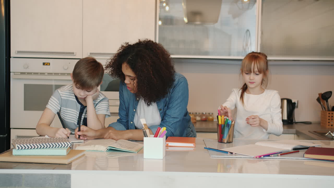 Children Doing Homework in a Kitchen