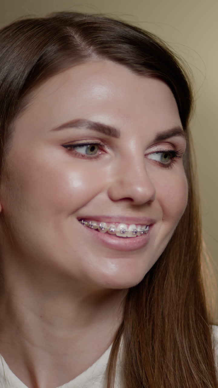 Woman with braces smiling