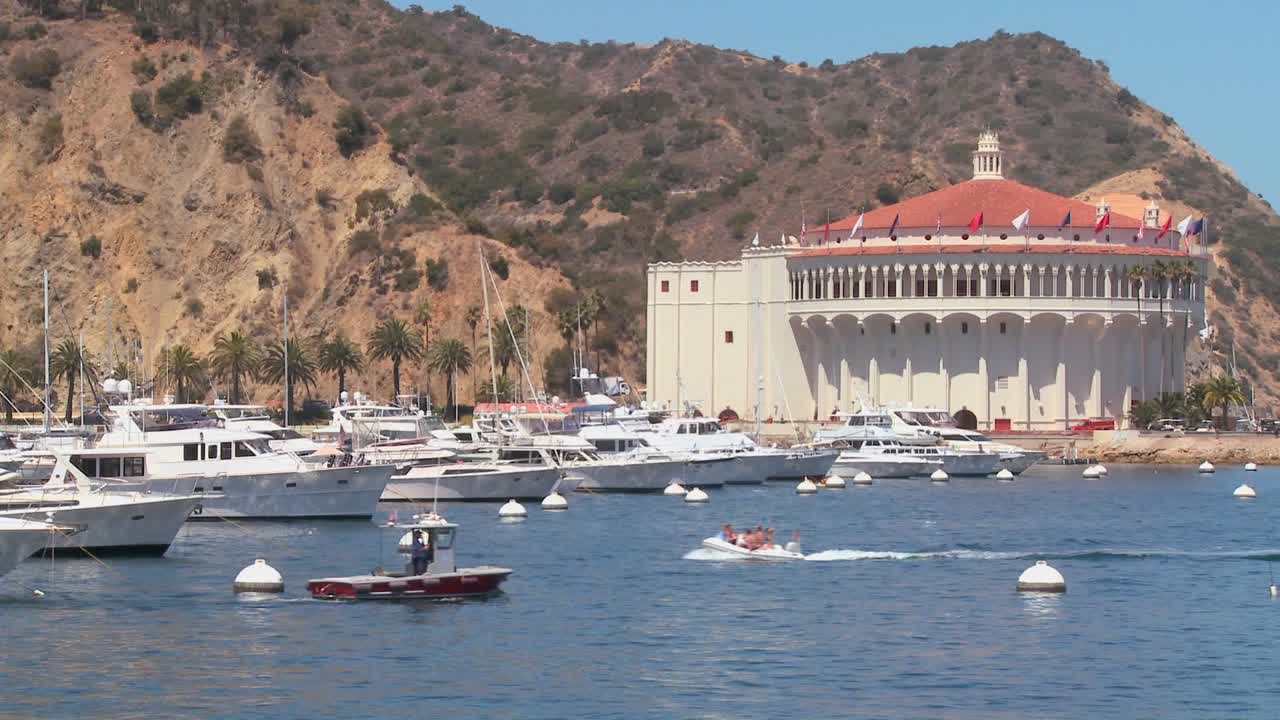 Boast crossing in front of the opera house on Catalina Island