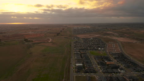 Slow-reveal-of-Australian-housing-estate-being-developed-parallel-to-open-green-field-subject-to-further-infrastructure-development